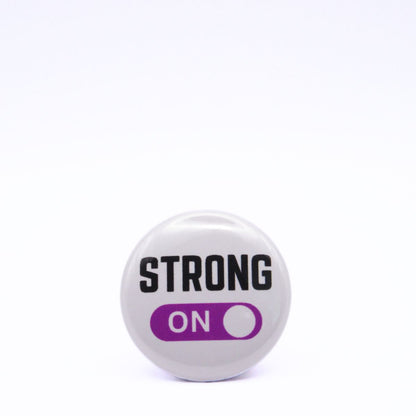 BooBooRoo Pinback Button (i.e. button, badge, pin) displaying strong mode is on. Purple background for mode indicator.