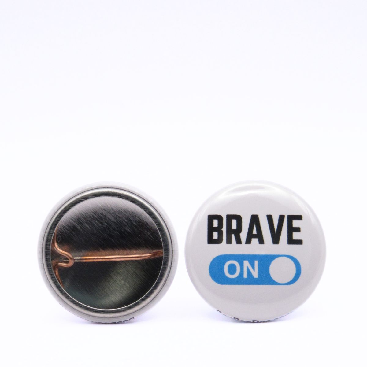BooBooRoo Pinback Button (i.e. button, badge, pin) displaying brave mode is on. Image showing front and back of high-quality metal button.