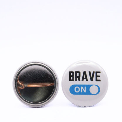 BooBooRoo Pinback Button (i.e. button, badge, pin) 3-pack displaying brave, fierce, and strong modes are on. Image showing front and back of high-quality metal button.