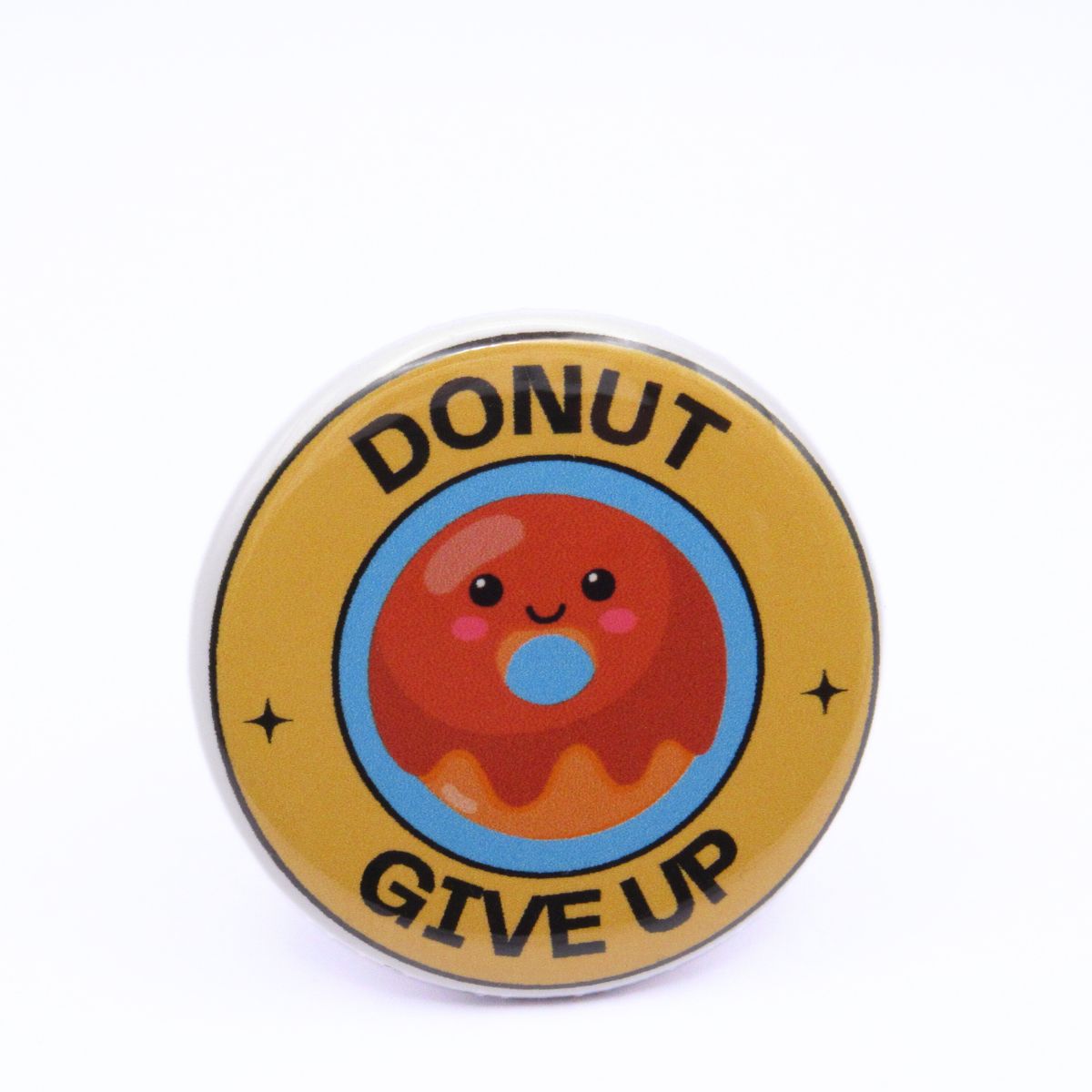 BooBooRoo Pinback Button (i.e. button, badge, pin) of a Cute Kawaii Style donut with the saying "Donut Give Up."