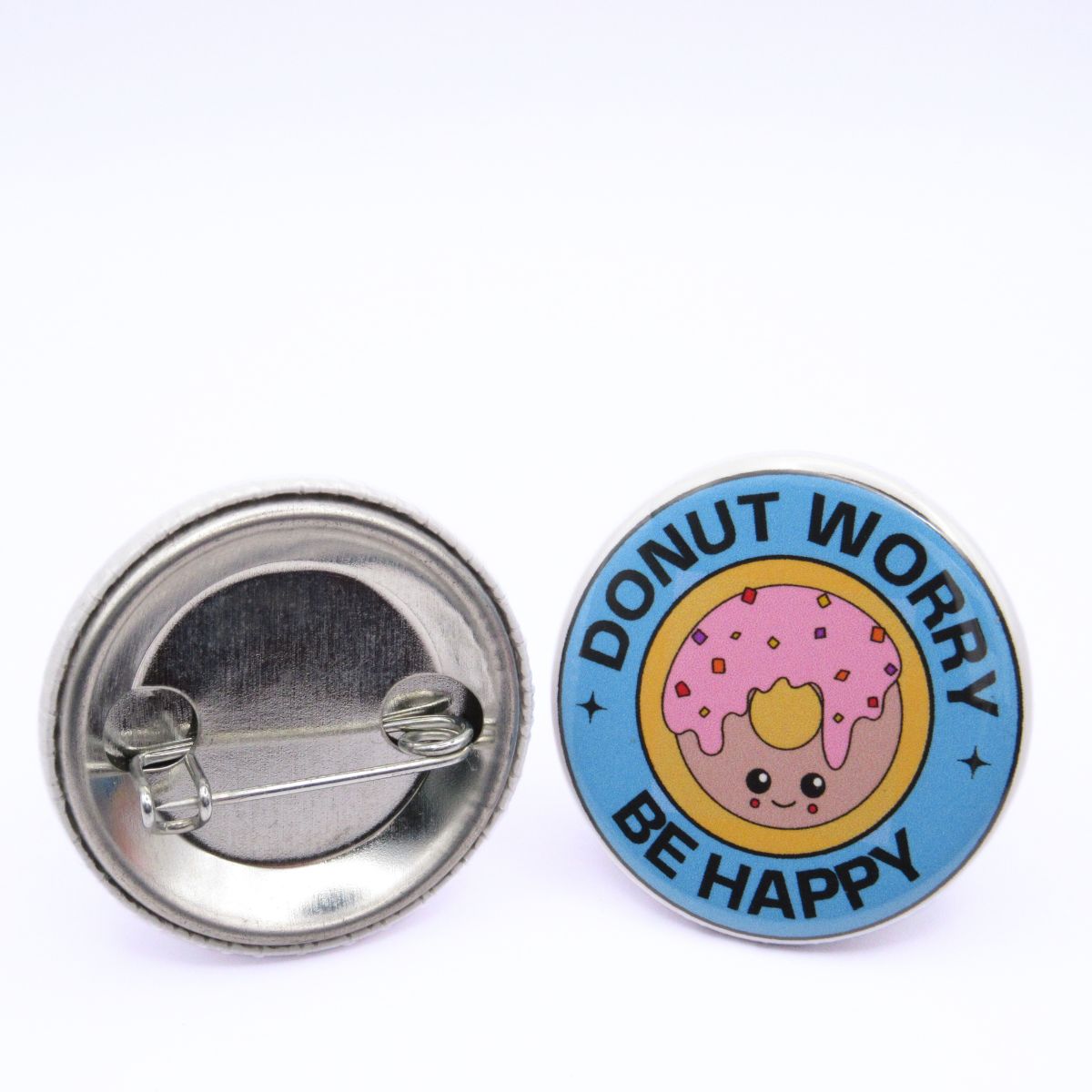 BooBooRoo Pinback Button (i.e. button, badge, pin) of a Cute Kawaii Style donut with the saying "Donut Worry, Be Happy." Image showing front and back of high-quality metal button.