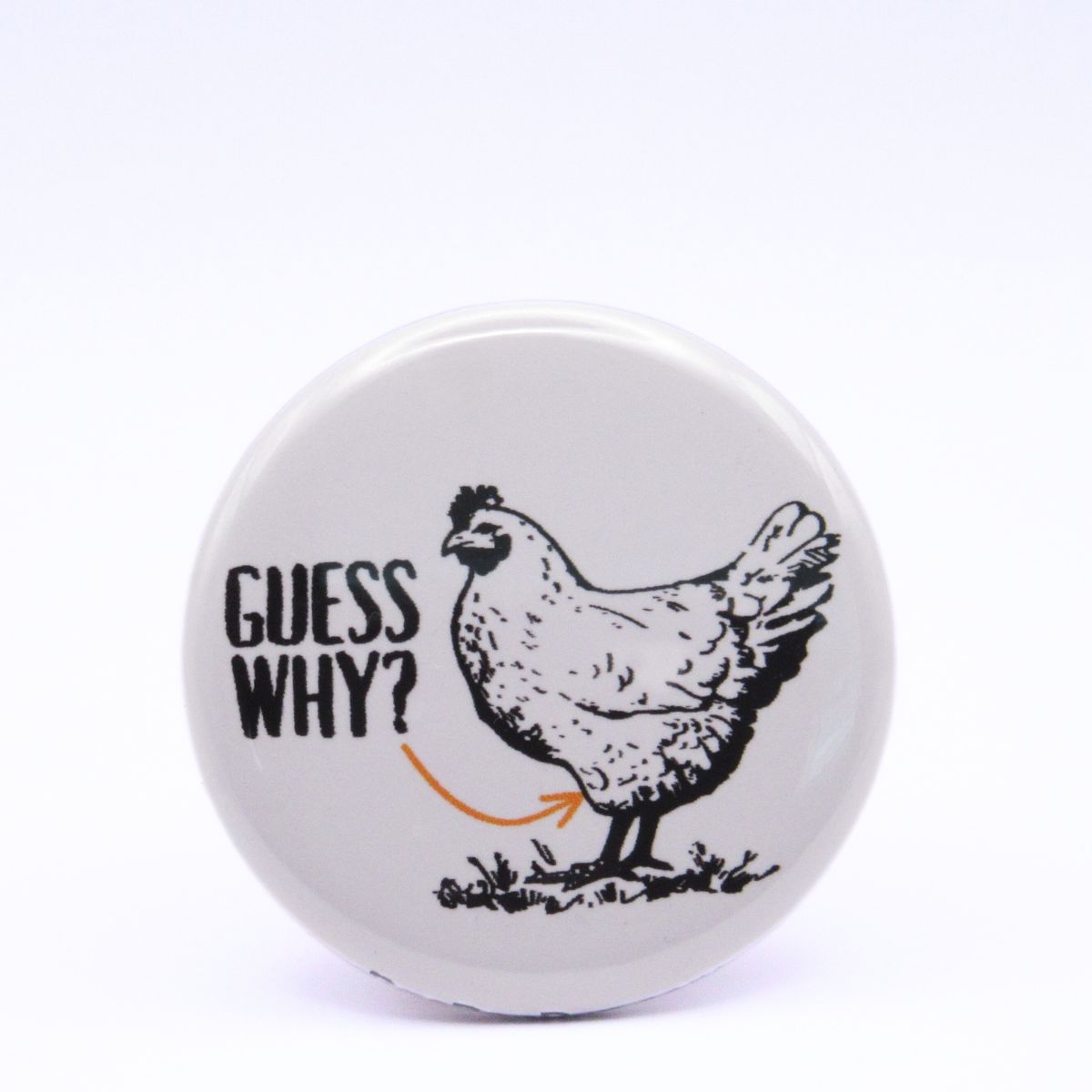 BooBooRoo Pinback Button (i.e. button, badge, pin) displaying a chicken with the words, "Guess Why" and an arrow pointing to the chicken's thigh.