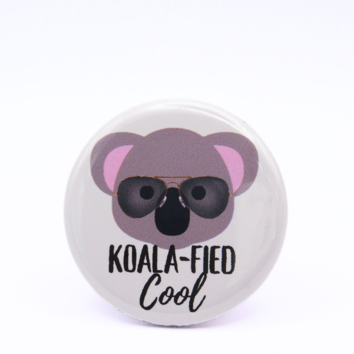 BooBooRoo Pinback Button (i.e. button, badge, pin) of the face of a koala wearing wayfarer sunglasses with the saying, "Koala-fied cool."
