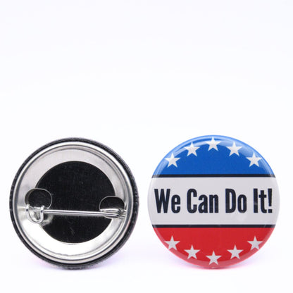 BooBooRoo Pinback Button (i.e. button, badge, pin) of Rosie the Riveter's saying of "We Can Do It!" on a red, white and blue background with white stars. Image showing front and back of high-quality metal button.
