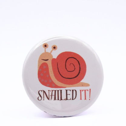 BooBooRoo Pinback Button (i.e. button, badge, pin) of a snail and the saying, "Snailed it!"