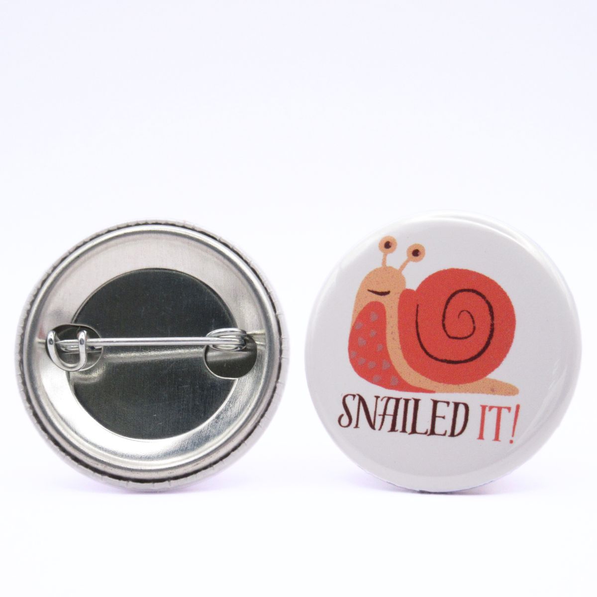 BooBooRoo Pinback Button (i.e. button, badge, pin) of a snail and the saying, "Snailed it!" Image showing front and back of high-quality metal button.