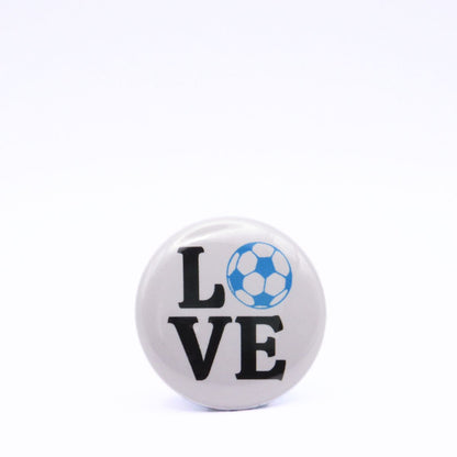 BooBooRoo Pinback Button (i.e. button, badge, pin) displaying the word "Love" with the "O" replaced by a soccer ball. Blue soccer ball with black text.