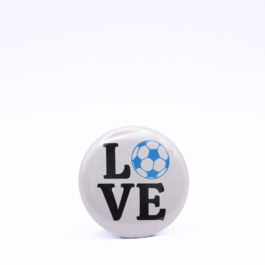 BooBooRoo Pinback Button (i.e. button, badge, pin) displaying the word "Love" with the "O" replaced by a soccer ball. Blue soccer ball with black text.