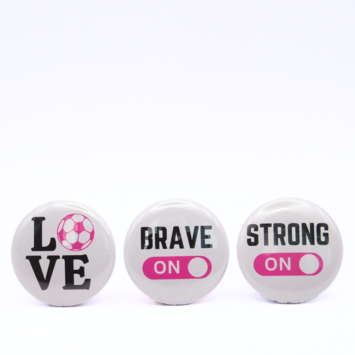 BooBooRoo Pinback Button (i.e. button, badge, pin) 3-pack displaying soccer love, fierce mode on, and strong mode on. Pink background for mode indicator and soccer ball.