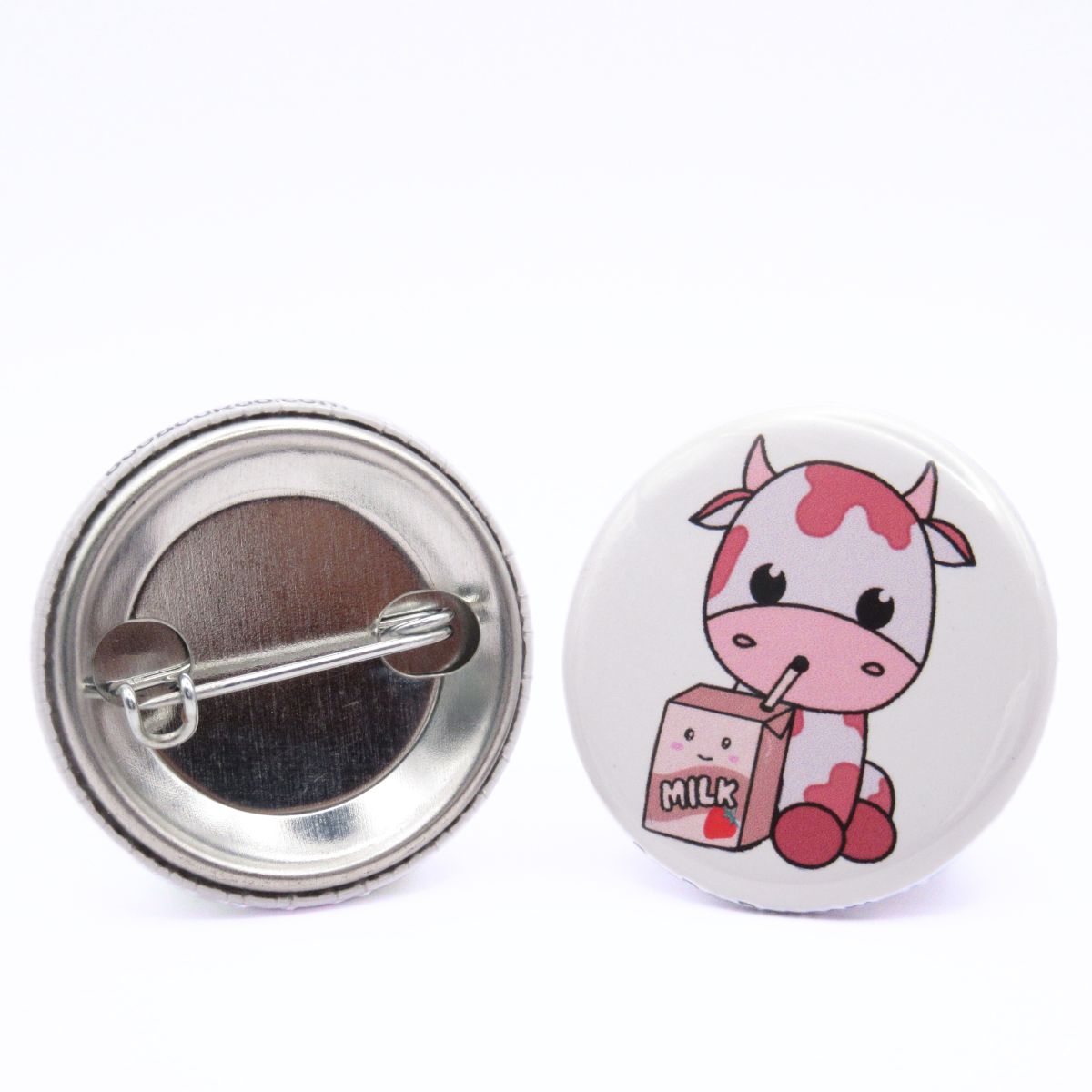 BooBooRoo Pinback Button (i.e. button, badge, pin) of a Cute Kawaii style pink, strawberry cow drinking strawberry milk from a straw from a small milk carton. Image showing front and back of high-quality metal button.