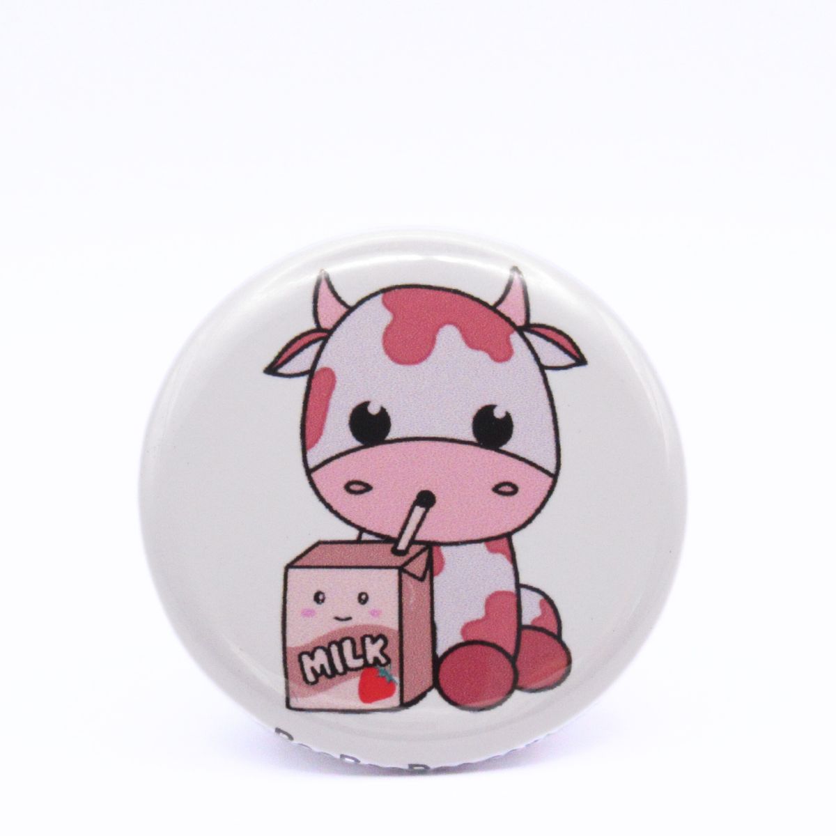 BooBooRoo Pinback Button (i.e. button, badge, pin) of a Cute Kawaii style pink, strawberry cow drinking strawberry milk from a straw from a small milk carton. 
