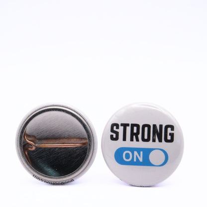 BooBooRoo Pinback Button (i.e. button, badge, pin) displaying strong mode is on. Image showing front and back of high-quality metal button.